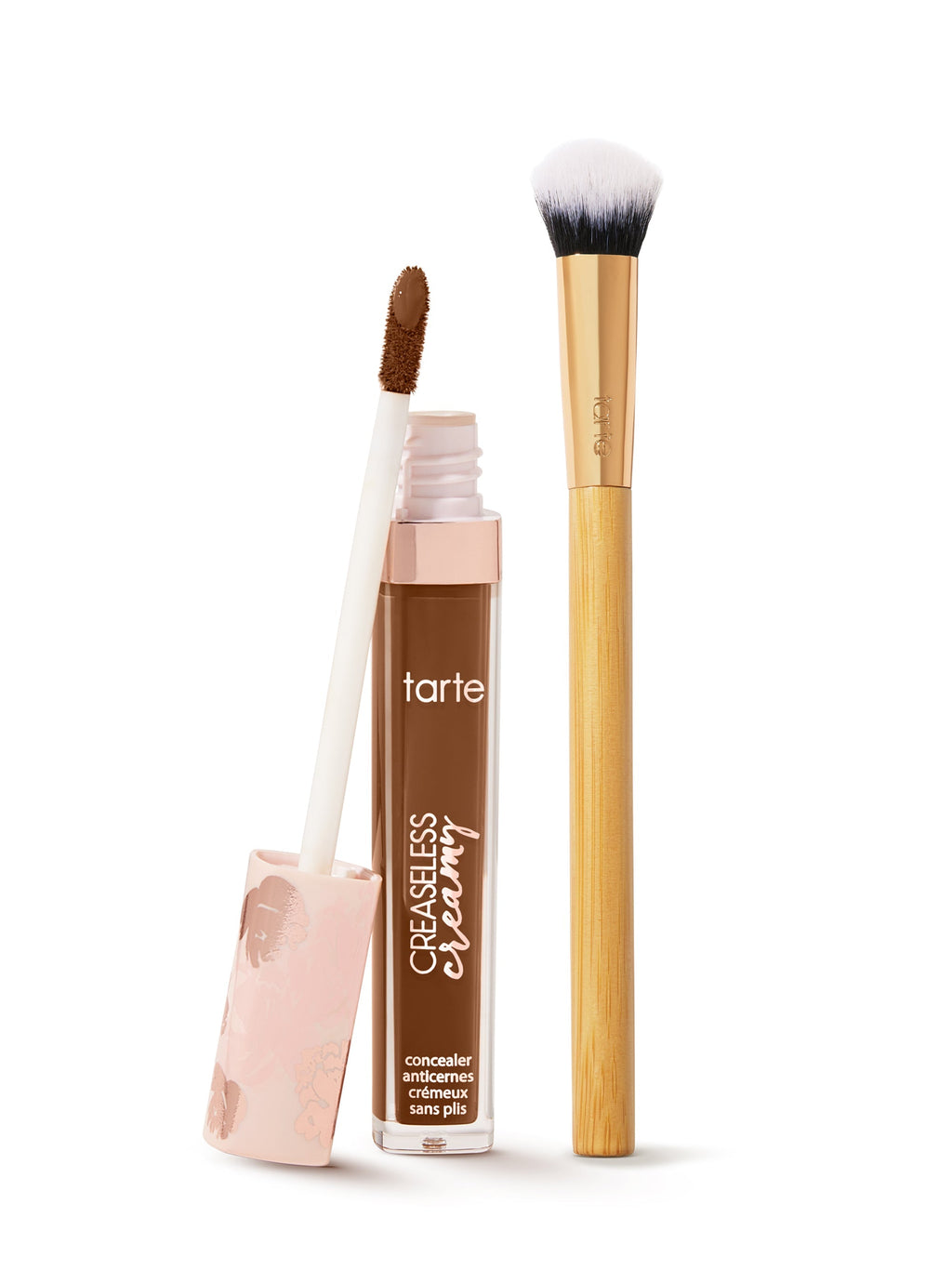  tarte creaseless creamy concealer  with applicator and brush on a white background