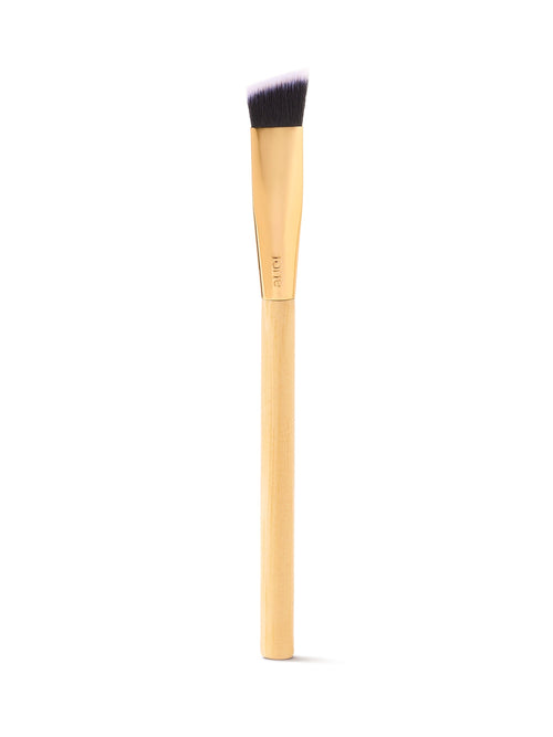 Makeup brush with wooden handle and black bristle head on a white background