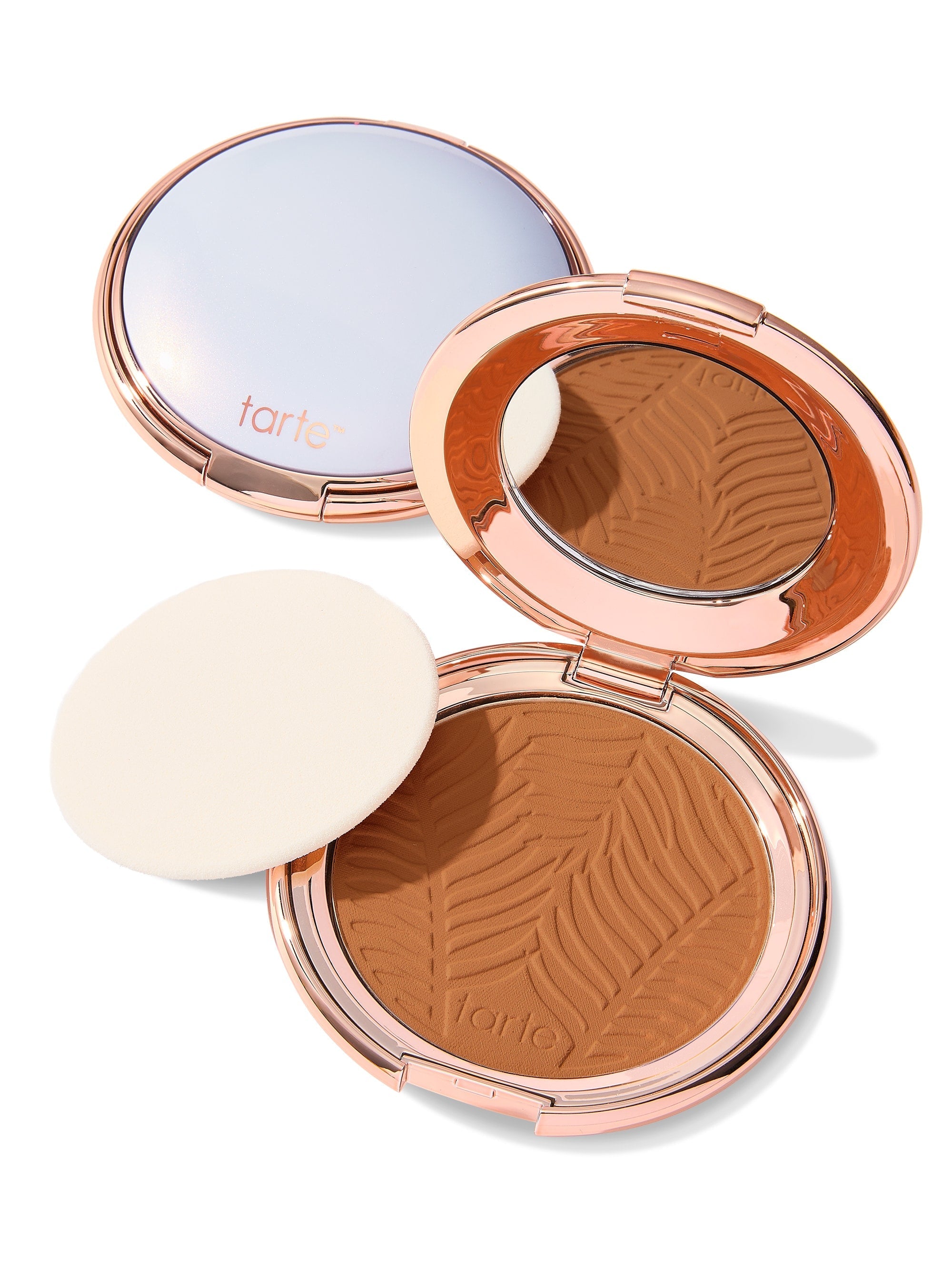 Compact powder with a zebra pattern and 'tarte' branding on a white background