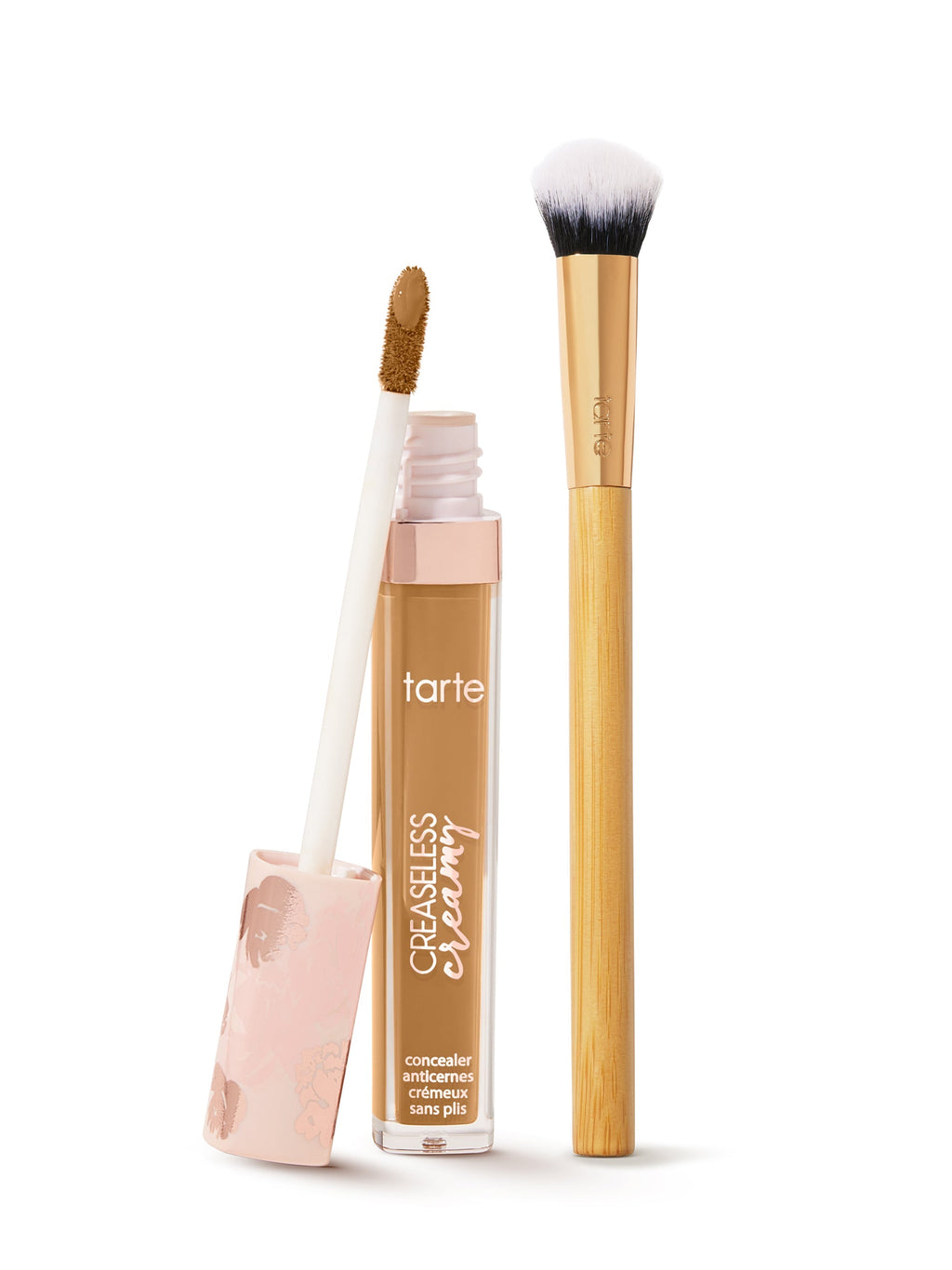 tarte creaseless creamy concealer  with applicator and brush on a white background