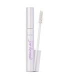 Mascara with white casing and brush on a white background