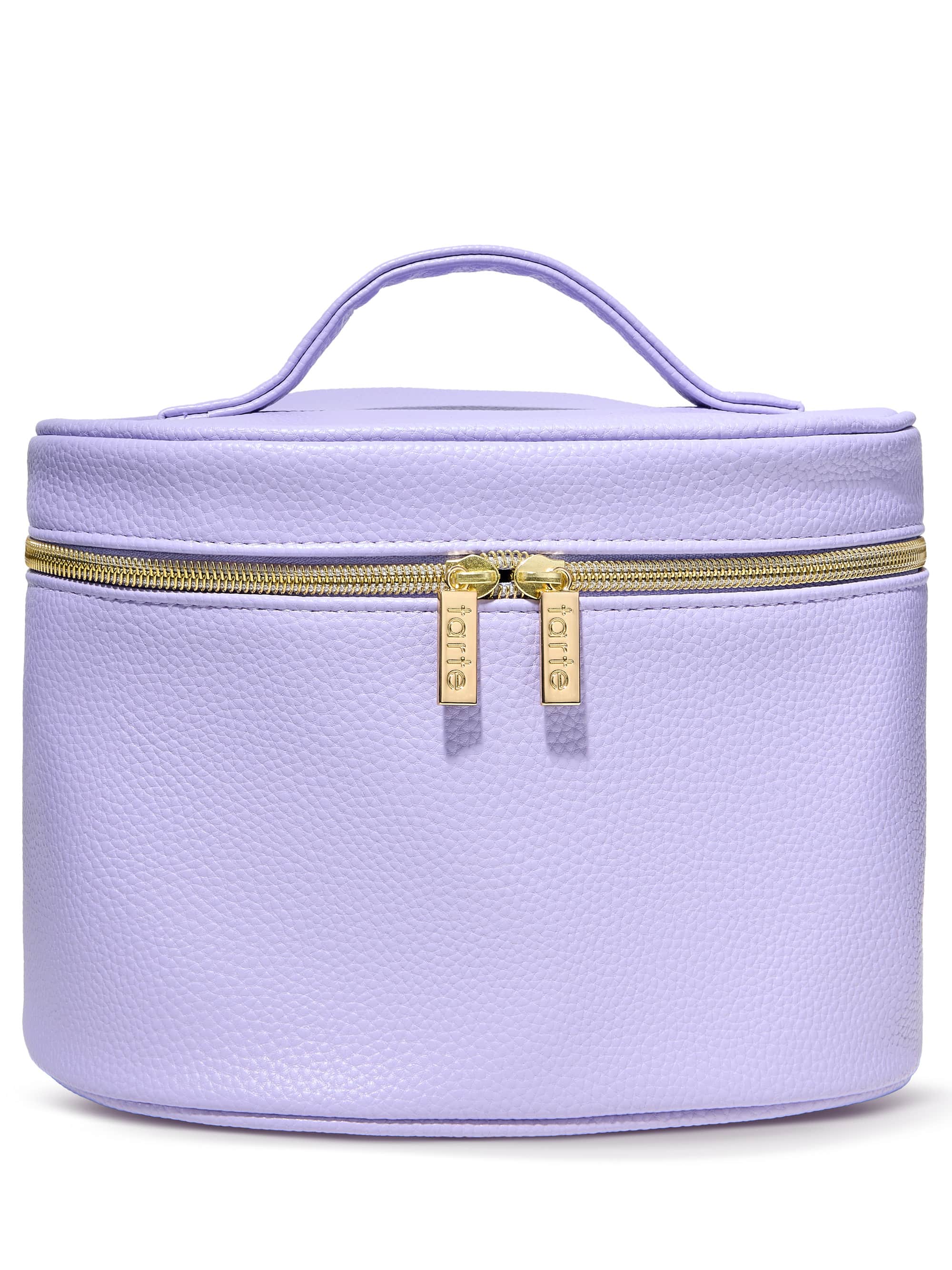 A lavender cylindrical cosmetic bag with a handle features a gold zipper and two tags labeled tarte, set against a plain white background.